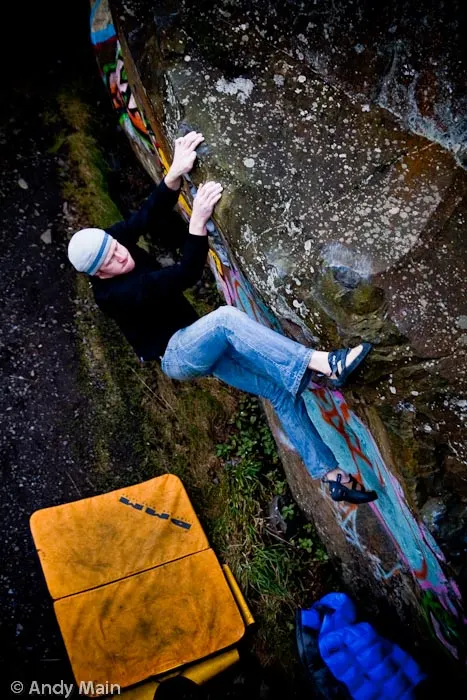 Tim Cross performs some delicate footwork as he oulders out The Railings at Dumbaton Rock.