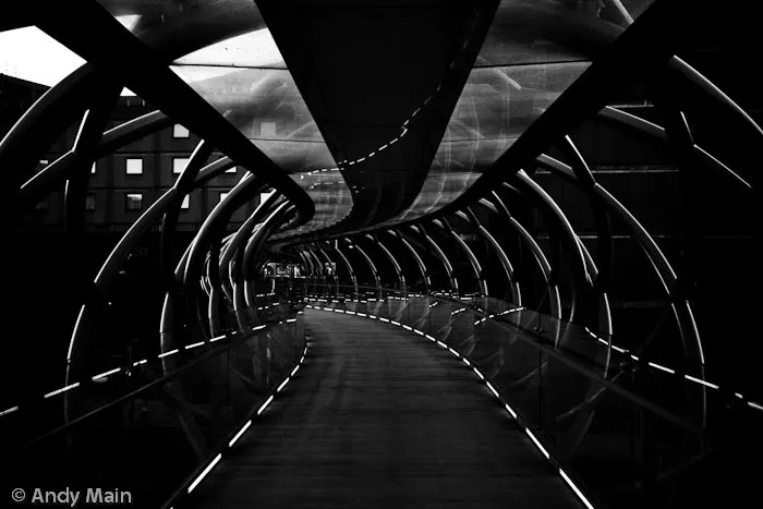 The harsh sun picks out the lines of the tunnel like bridge over Leith Walk.
