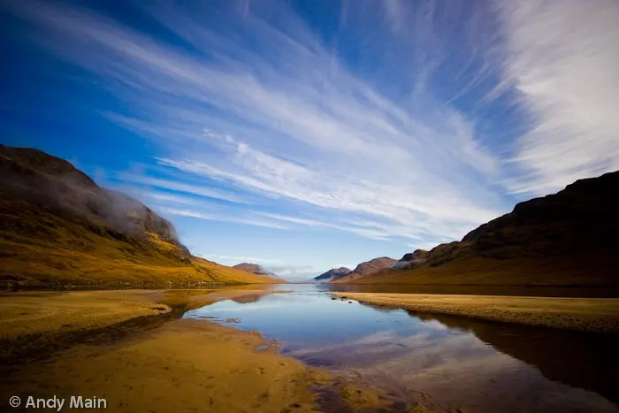 We had bivied next to the lochan on a star lit night, but woke up in the mist. As we were about give up and head home it started to clear, the mirror like Lochan Na H-Earba and Binnein Shuas emerging from the mist.